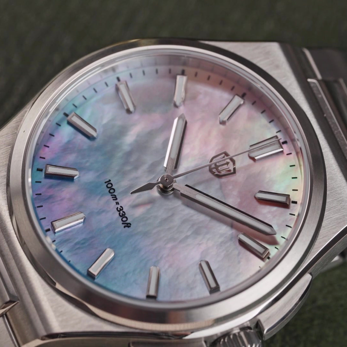 Watchdives WD2007A mother-of-pearl dial macro with pink and blue iridescence