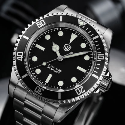 Watchdives WD5514Q 40mm quartz dive watch, matte black dial with sword hands, angled dial close-up, 316L stainless steel bracelet.