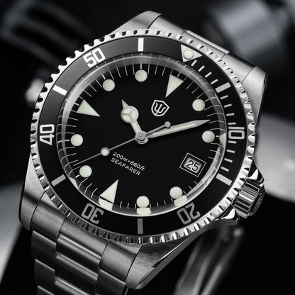 Watchdives WD5514Q 40mm quartz dive watch, matte black dial with Mercedes-style hands and date, angled dial close-up, 316L stainless steel bracelet.