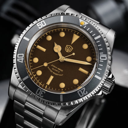 Watchdives WD5514Q 40mm quartz dive watch, tropical brown dial with yellow indices, angled dial close-up, 316L stainless steel bracelet.