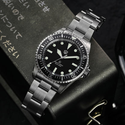 Watchdives WD5514Q 40mm quartz dive watch, matte black dial with Mercedes-style hands, watch displayed on textured surface, 316L stainless steel bracelet.
