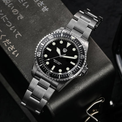Watchdives WD5514Q 40mm quartz dive watch, black dial with grey bezel and Mercedes-style hands, watch displayed on textured surface, 316L stainless steel bracelet.