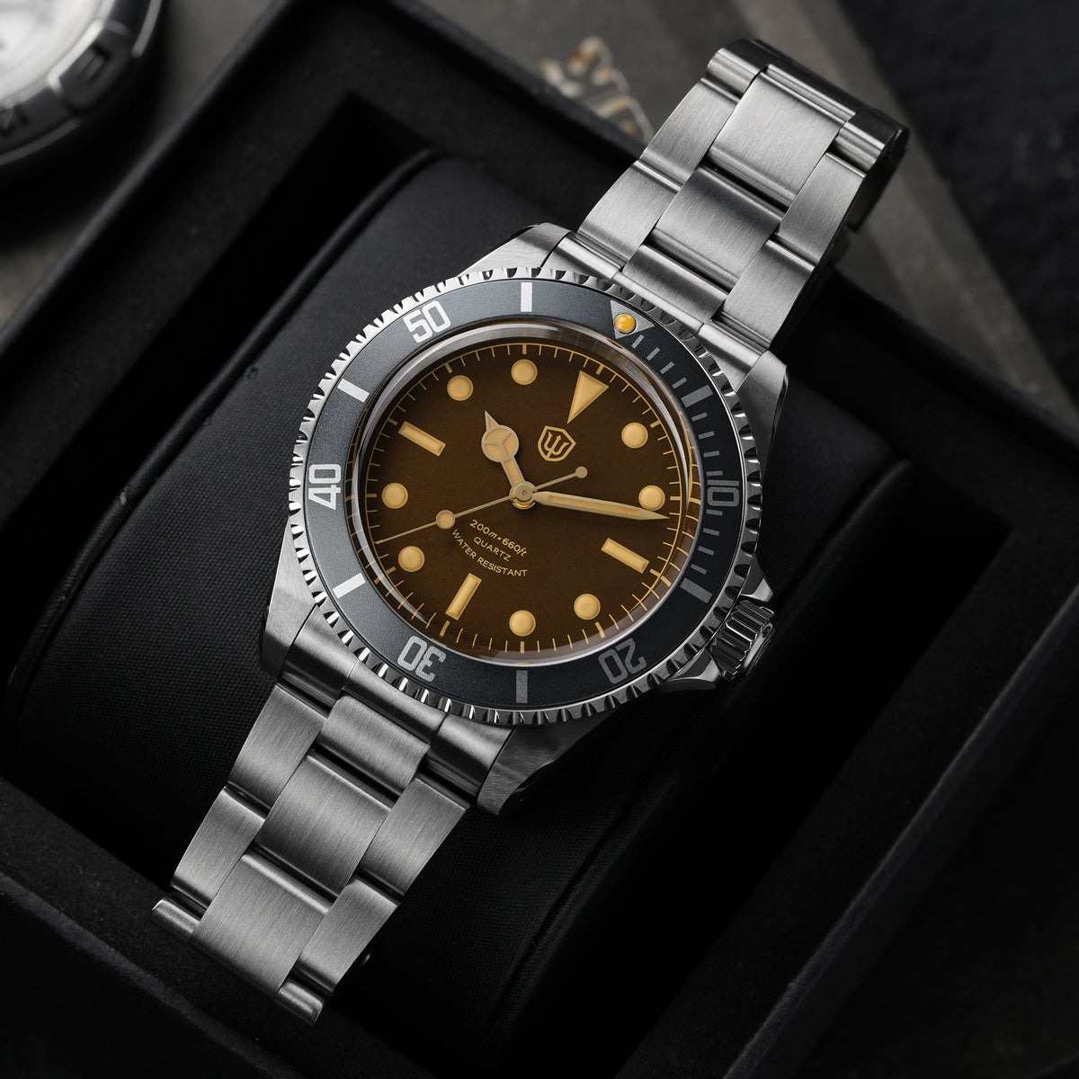 Watchdives WD5514Q 40mm quartz dive watch, tropical brown dial with yellow indices, three-quarter bracelet view, 316L stainless steel bracelet.