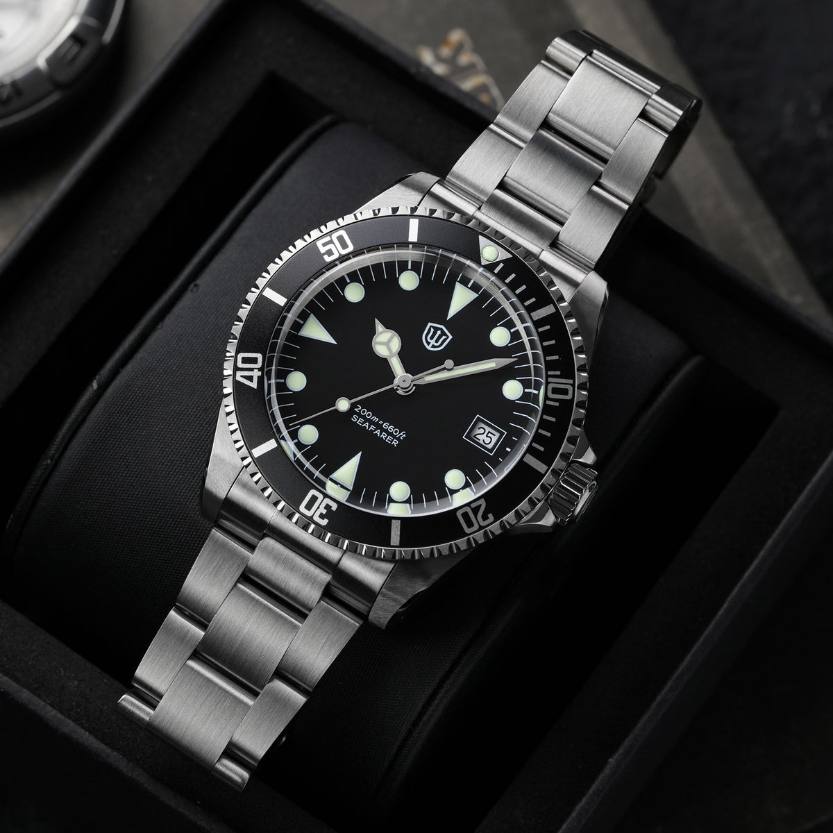 Watchdives WD5514Q 40mm quartz dive watch, matte black dial with Mercedes-style hands and date, three-quarter bracelet view, 316L stainless steel bracelet.