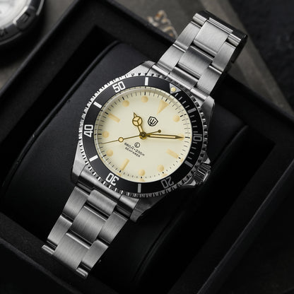 Watchdives WD5514Q 40mm quartz dive watch, cream dial with gold-tone details, angled dial close-up, 316L stainless steel bracelet.