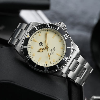 Watchdives WD5514Q 40mm quartz dive watch, cream dial with gold-tone details, watch displayed on textured surface, 316L stainless steel bracelet.