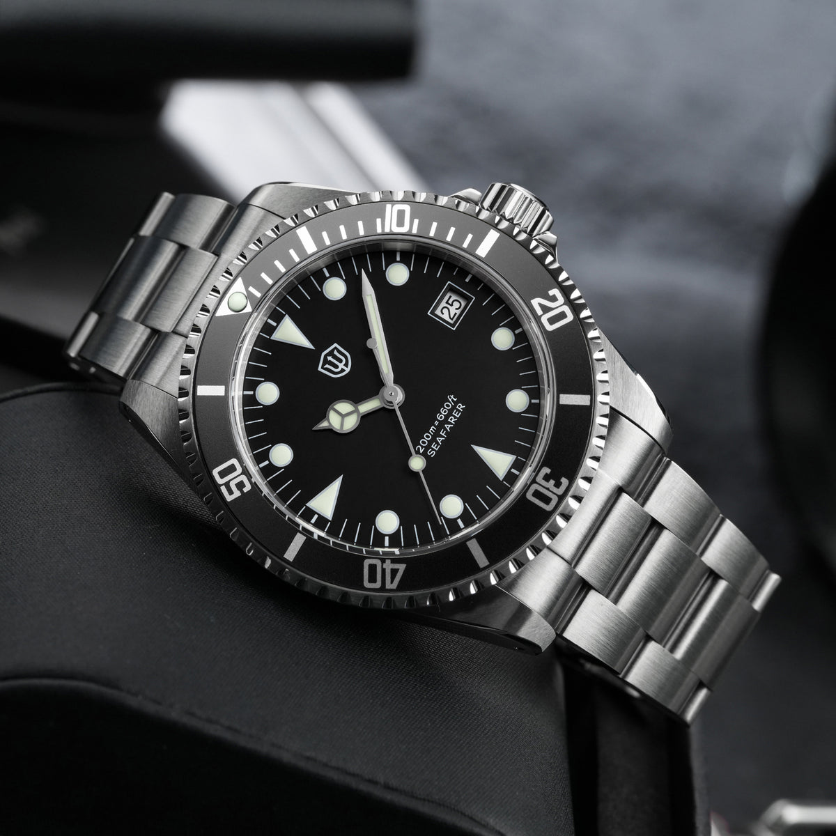 Watchdives WD5514Q 40mm quartz dive watch, matte black dial with Mercedes-style hands and date, angled side view, 316L stainless steel bracelet.