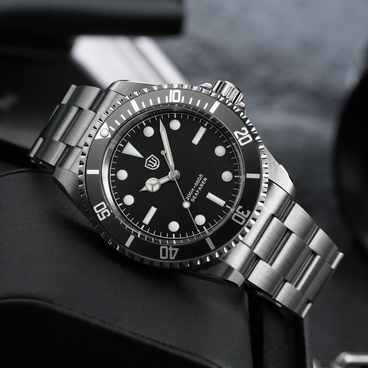 Watchdives WD5514Q 40mm quartz dive watch, matte black dial with sword hands, angled side view, 316L stainless steel bracelet.