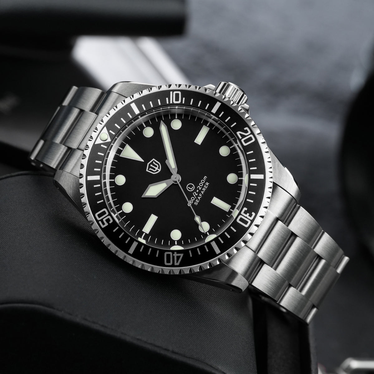 Watchdives WD5514Q 40mm quartz dive watch, matte black dial with Mercedes-style hands, angled side view, 316L stainless steel bracelet.