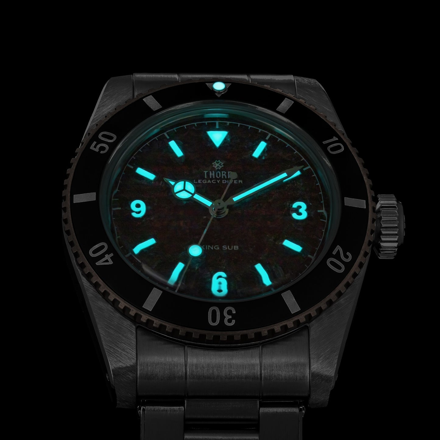 THORN T029 BGW9 blue lume dial close-up in the dark