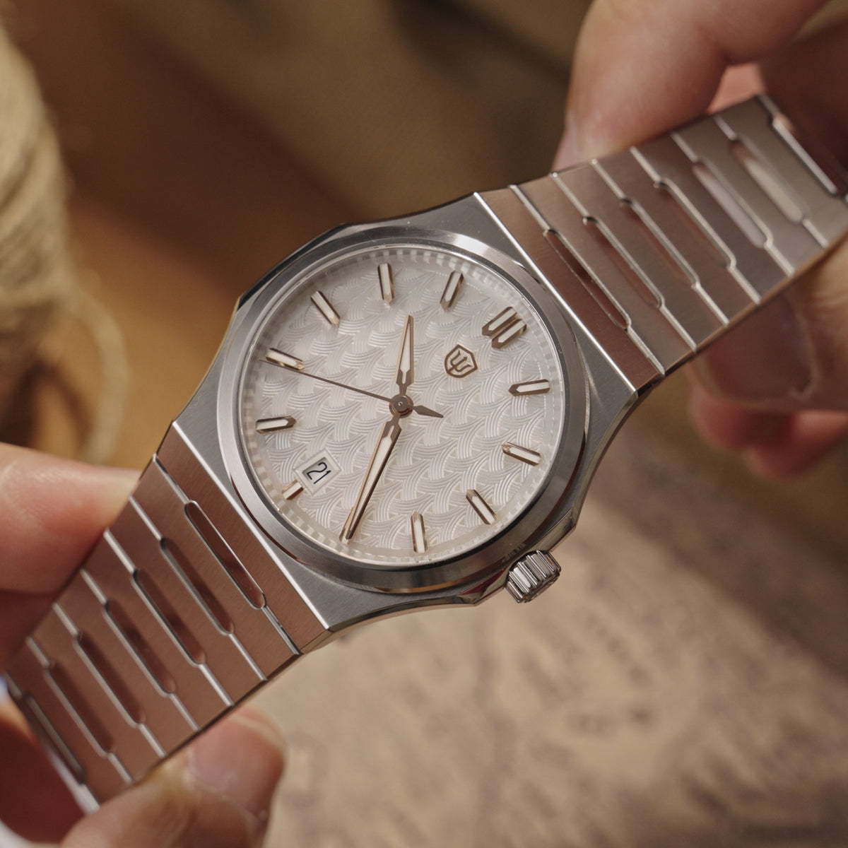 Watchdives WDC0001 PREMIER Forest White MOP dial close-up showing the carved pattern and rose-gold-tone hands