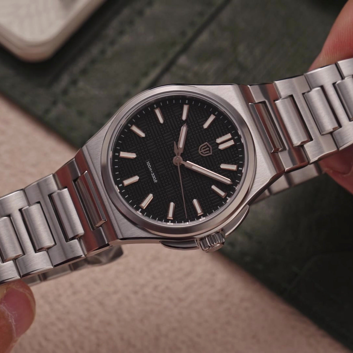 Watchdives WD2007A black textured dial with applied hour markers and steel bracelet