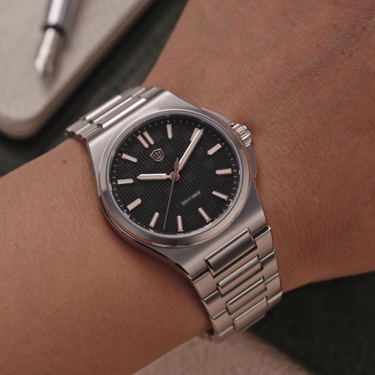 Watchdives WD2007A black textured dial watch worn on wrist