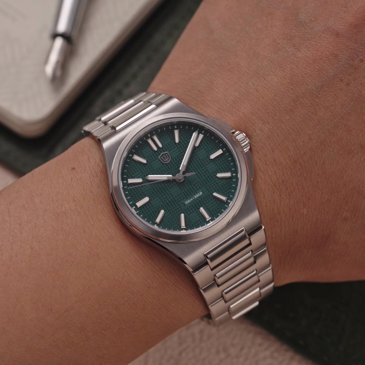 Watchdives WD2007A teal blue textured dial watch worn on wrist