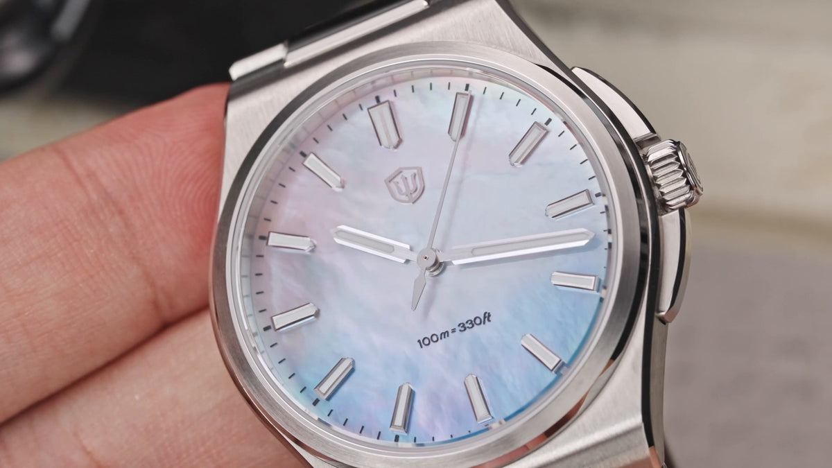 Watchdives WD2007A mother-of-pearl dial reflecting pink and blue tones